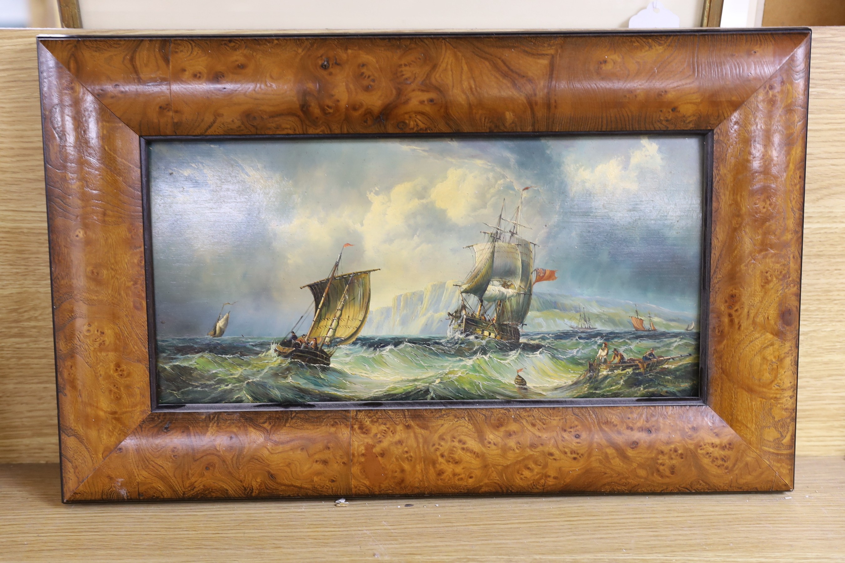 After William Webb, oil on panel, Shipping off the coast, bears signature, 19 x 39cm